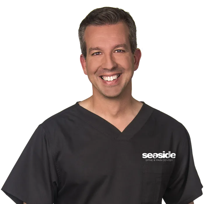Dr. Manuel López, MD, board-certified pain management physician at Seaside Spine and Pain Center in Palm Coast, Florida